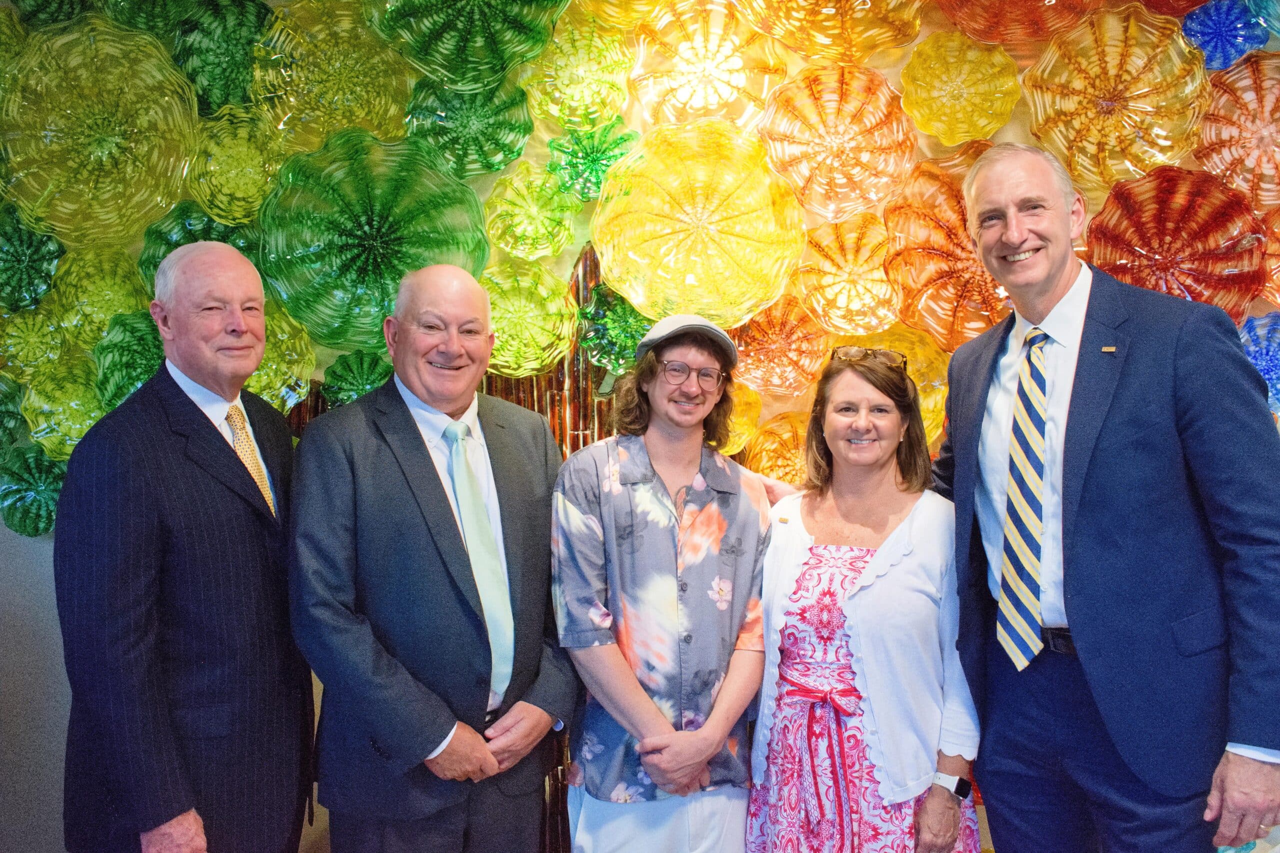 townebank team in front of Seasons of Life blown glass art installation